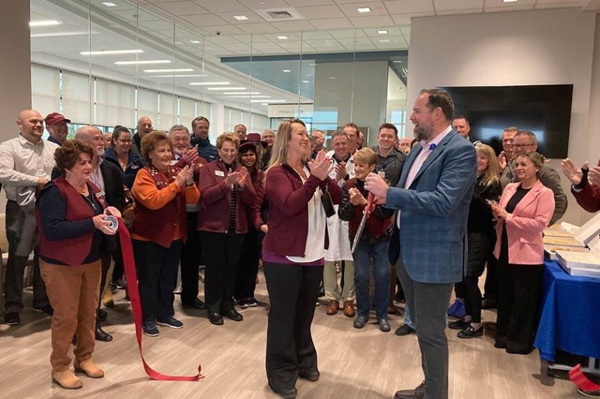 Jordan Herget, CEO of Protneuf Medical Center is shown cutting the ribbon at the new Portnuef Health Now urgent care. 